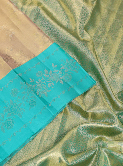 Pure kanchipuram Tissue silk saree gold and teal green with allover zari weaves and floral design zari border