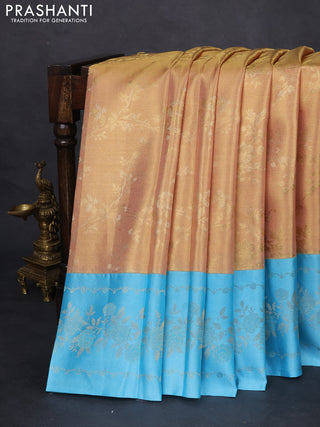 Pure kanchipuram Tissue silk saree gold and light blue with allover zari weaves and floral design zari border