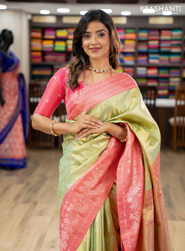 Pure kanchipuram Tissue silk saree pista green and peach shade with allover zari weaves and floral design zari border