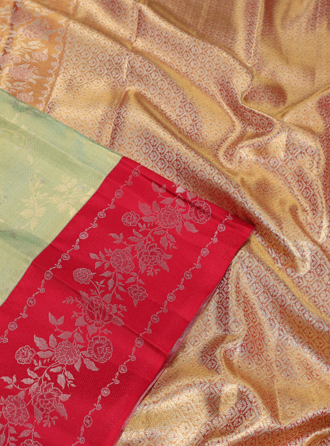 Pure kanchipuram Tissue silk saree pista green and red with allover zari weaves and floral design zari border