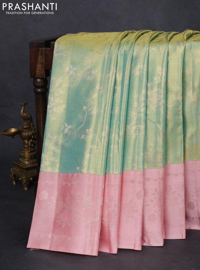 Pure kanchipuram Tissue silk saree teal green and peach shade with allover zari weaves and floral design zari border