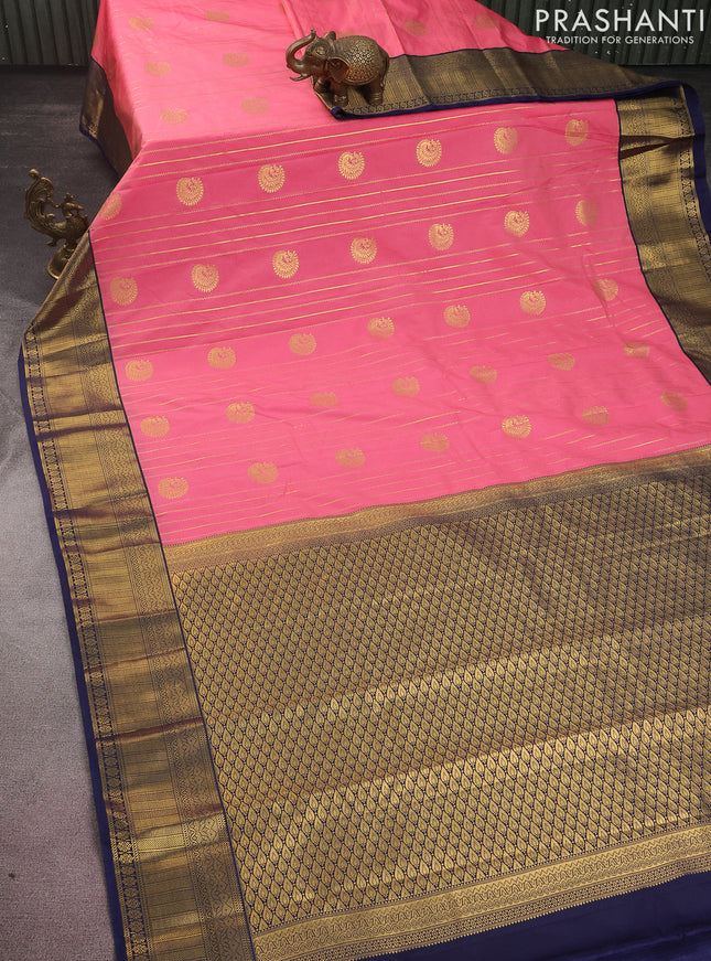 Semi kanchipuram silk saree peach pink and navy blue with allover zari weaves & buttas and zari woven korvai border
