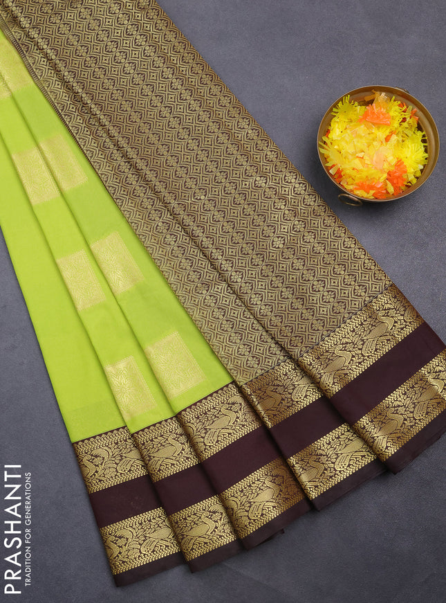 Semi kanchipuram silk saree fluorescent green and coffee brown with zari woven box type buttas and rettapet zari woven korvai border