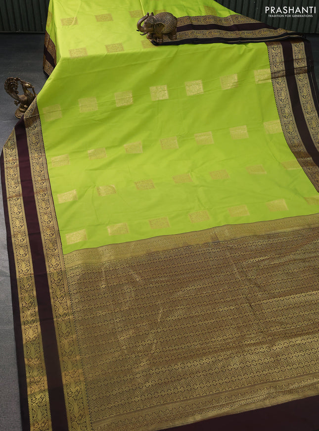 Semi kanchipuram silk saree fluorescent green and coffee brown with zari woven box type buttas and rettapet zari woven korvai border