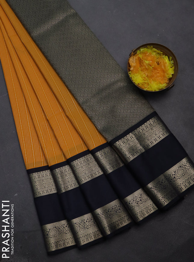 Semi kanchipuram silk saree mango yellow and dark navy blue with allover zari woven stripes pattern and rettapet zari woven korvai border