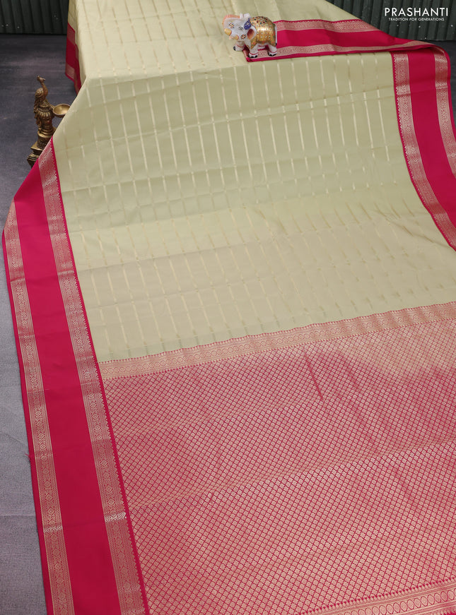 Semi kanchipuram silk saree mild pista green and pink with allover zari woven stripes pattern and rettapet zari woven korvai border
