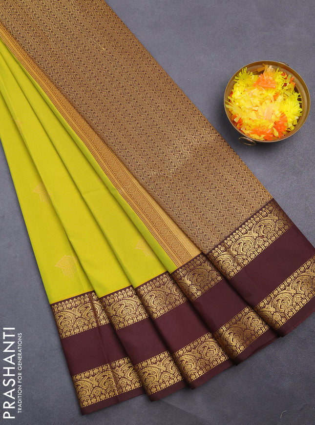Semi kanchipuram silk saree lime yellow and deep maroon with zari woven buttas and rettapet zari woven korvai border