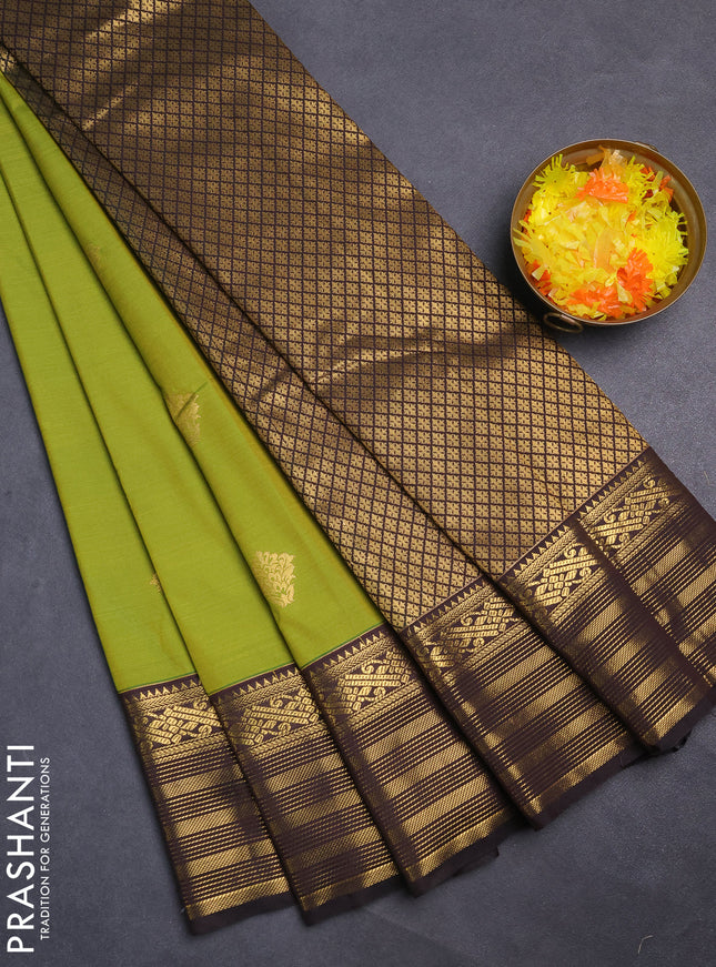 Semi kanchipuram silk saree light green and deep coffee brown with zari woven buttas and zari woven korvai border