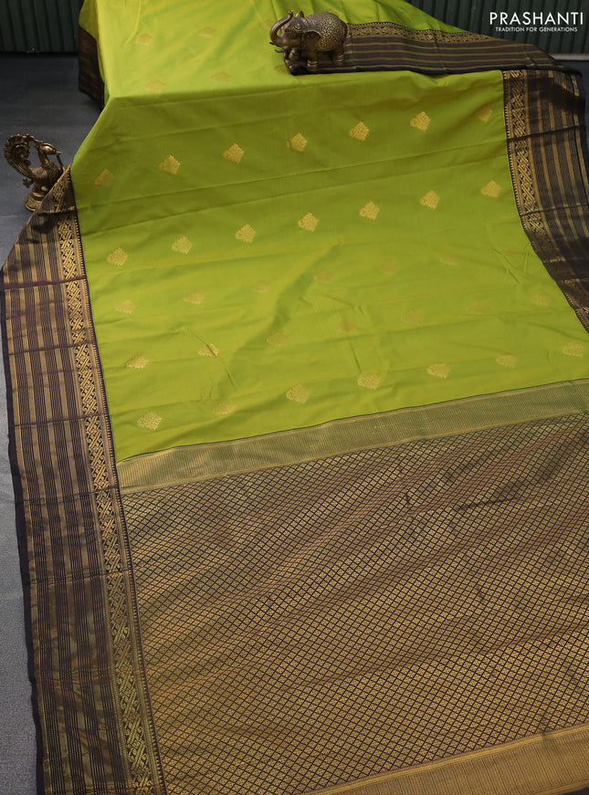 Semi kanchipuram silk saree light green and deep coffee brown with zari woven buttas and zari woven korvai border