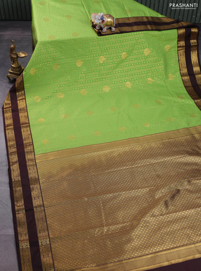 Semi kanchipuram silk saree light green and coffee brown with allover zari weaves & buttas and rettapet zari woven korvai border