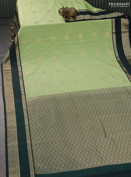 Semi kanchipuram silk saree pista green and bottle green with allover zari weaves & buttas and rettapet zari woven korvai border