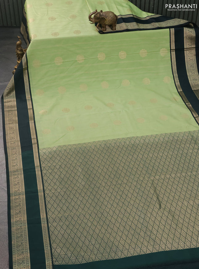 Semi kanchipuram silk saree pista green and bottle green with allover zari weaves & buttas and rettapet zari woven korvai border