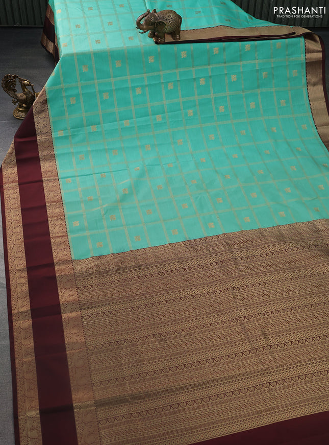 Semi kanchipuram silk saree teal green and deep maroon with allover zari checks & buttas and rettapet zari woven korvai border