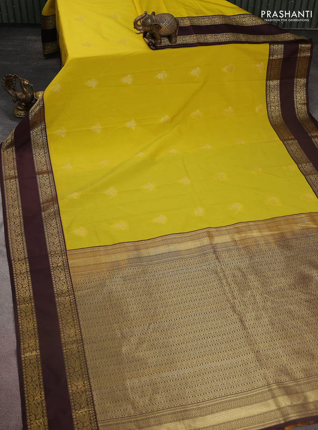 Semi kanchipuram silk saree lime yellow and coffee brown with zari woven buttas and rettapet zari woven korvai border
