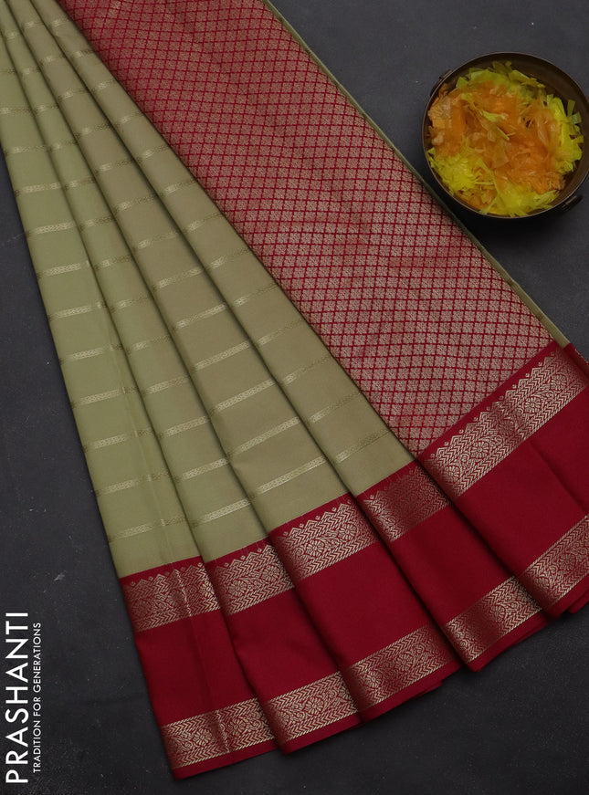 Semi kanchipuram silk saree sandal and pink with zari woven stripes pattern and rettapet zari woven korvai border