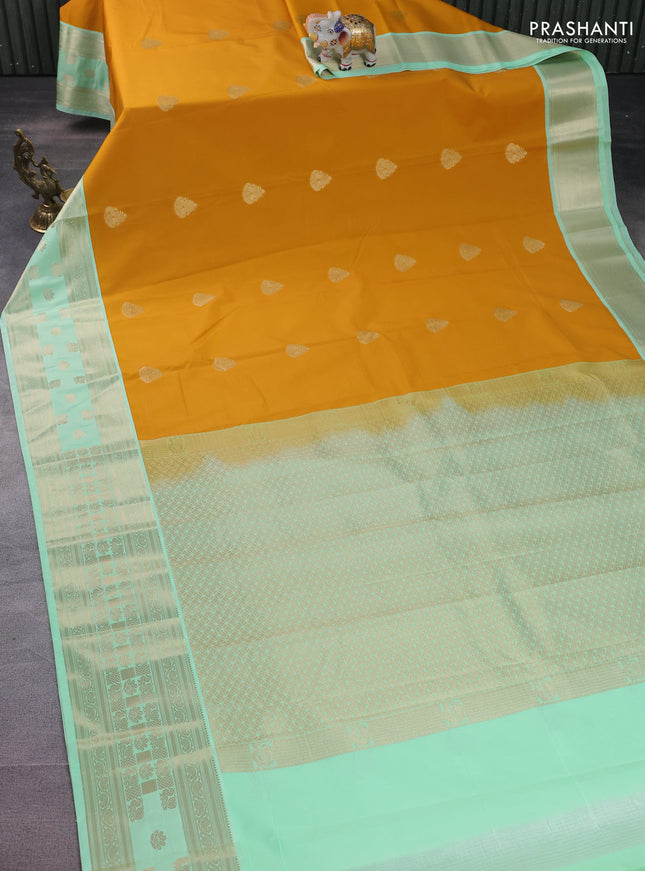 Semi kanchipuram silk saree mustard yellow and teal green with zari woven buttas and rettapet zari woven korvai border