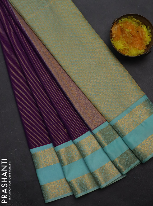 Semi kanchipuram silk saree purple and light blue with allover zari weaves & buttas and rettapet zari woven korvai border