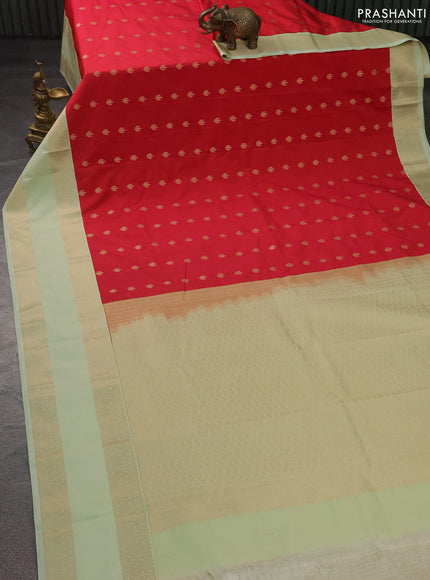 Semi kanchipuram silk saree reddish pink and pista green with allover zari weaves & buttas and rettapet zari woven korvai border