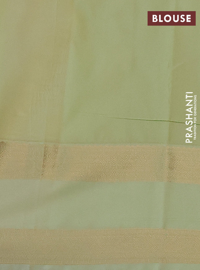 Semi kanchipuram silk saree reddish pink and pista green with allover zari weaves & buttas and rettapet zari woven korvai border