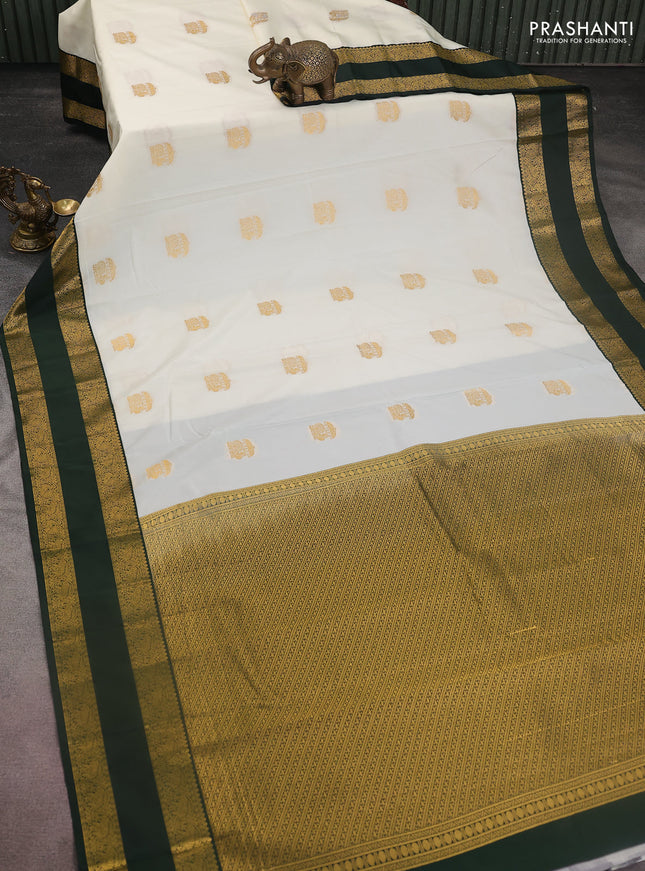 Semi kanchipuram silk saree off white and bottle green with annam zari woven buttas and rettapet zari woven korvai border