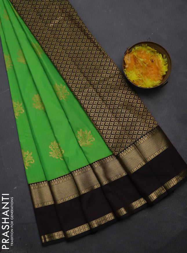 Semi kanchipuram silk saree light green and deep coffee brown with floral zari woven buttas and rettapet zari woven korvai border