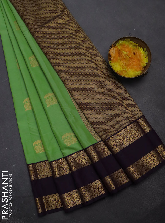 Semi kanchipuram silk saree pastel green and deep jamun with annam zari woven buttas and rettapet zari woven korvai border