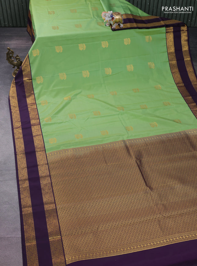 Semi kanchipuram silk saree pastel green and deep jamun with annam zari woven buttas and rettapet zari woven korvai border
