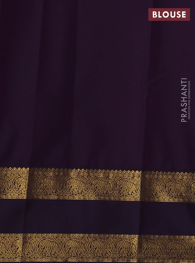 Semi kanchipuram silk saree pastel green and deep jamun with annam zari woven buttas and rettapet zari woven korvai border