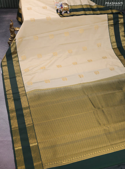 Semi kanchipuram silk saree sandal and bottle green with annam zari woven buttas and rettapet zari woven korvai border