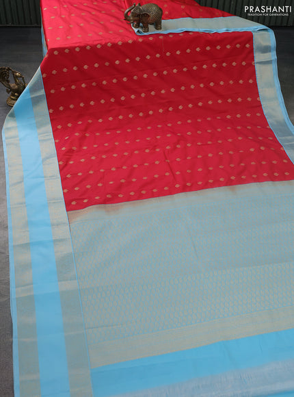 Semi kanchipuram silk saree reddish pink and light blue with zari woven buttas and rettapet zari woven korvai border