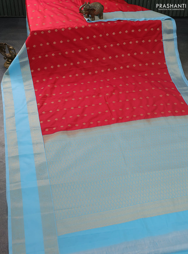 Semi kanchipuram silk saree reddish pink and light blue with zari woven buttas and rettapet zari woven korvai border