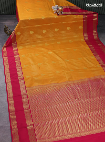 Semi kanchipuram silk saree mango yellow and pink with allover zari weaves & buttas and rettapet zari woven korvai border