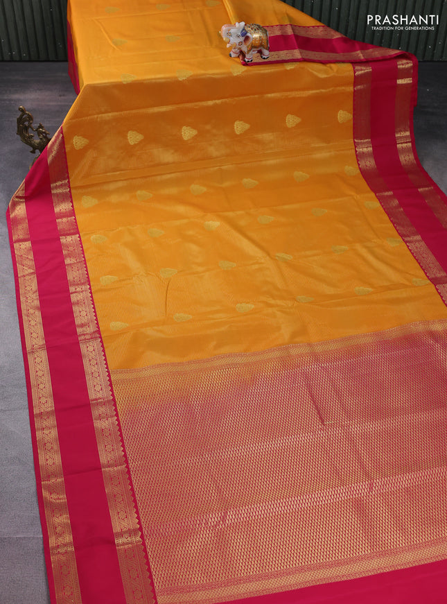 Semi kanchipuram silk saree mango yellow and pink with allover zari weaves & buttas and rettapet zari woven korvai border