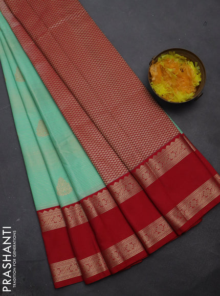 Semi kanchipuram silk saree teal green shade and red with allover zari weaves & buttas and rettapet zari woven korvai border