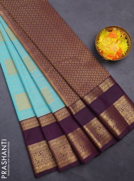 Semi kanchipuram silk saree teal blue and deep purple with allover zari weaves & buttas and rettapet zari woven korvai border