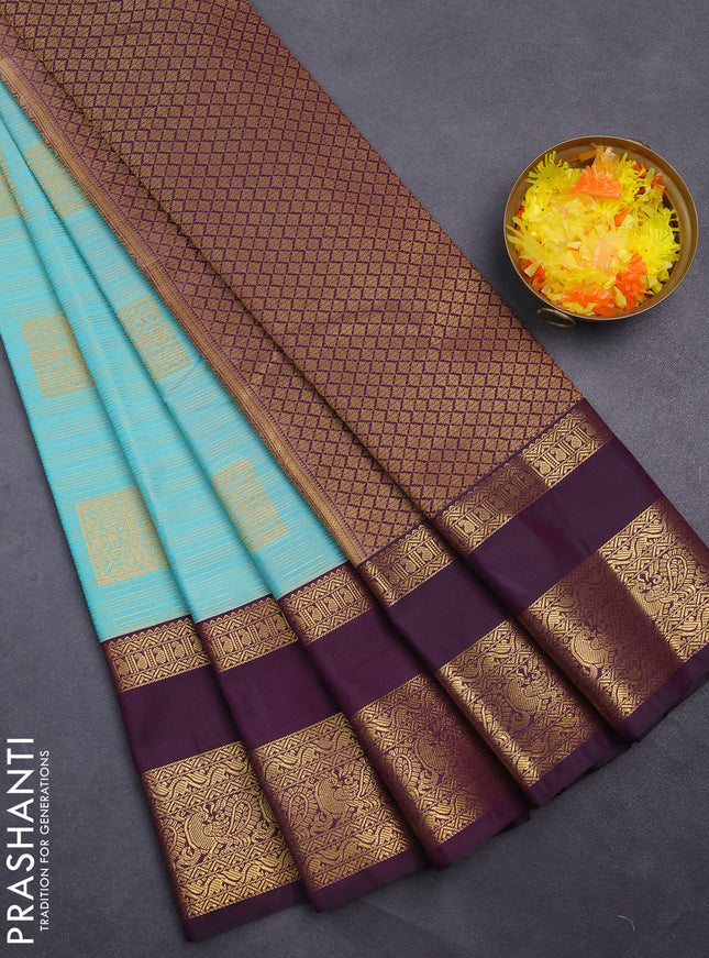 Semi kanchipuram silk saree teal blue and deep purple with allover zari weaves & buttas and rettapet zari woven korvai border