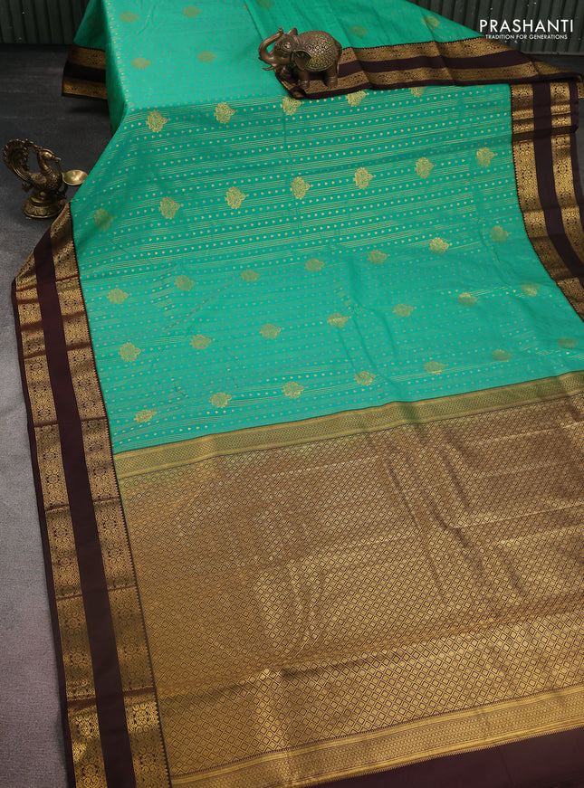 Semi kanchipuram silk saree teal green and brown with allover zari weaves & buttas and rettapet zari woven korvai border