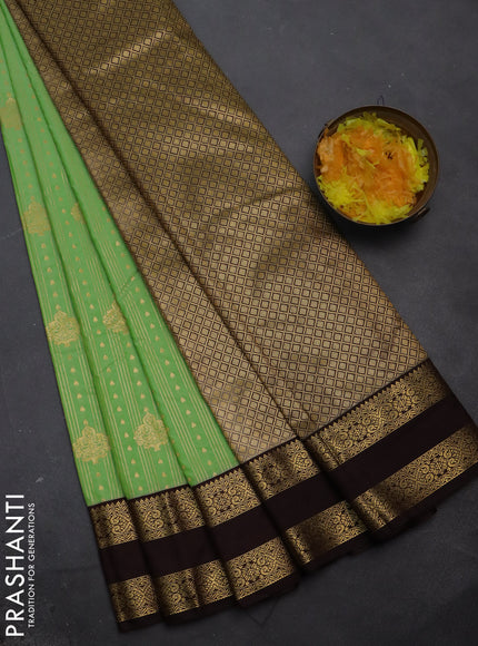 Semi kanchipuram silk saree pista green and brown with allover zari weaves & buttas and rettapet zari woven korvai border
