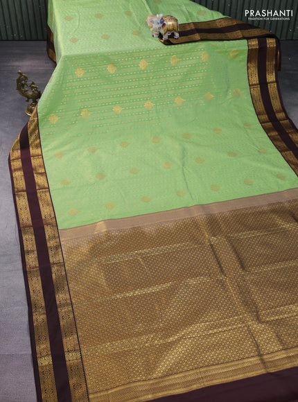 Semi kanchipuram silk saree pista green and brown with allover zari weaves & buttas and rettapet zari woven korvai border