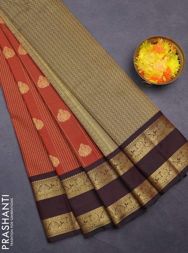 Semi kanchipuram silk saree rust shade and deep maroon with allover small zari checks & buttas and rettapet zari woven korvai border