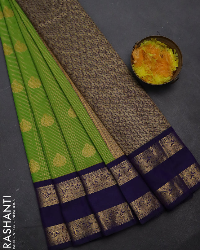 Semi kanchipuram silk saree light green and navy blue with allover small zari checks & buttas and rettapet zari woven korvai border