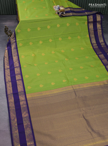 Semi kanchipuram silk saree light green and navy blue with allover small zari checks & buttas and rettapet zari woven korvai border