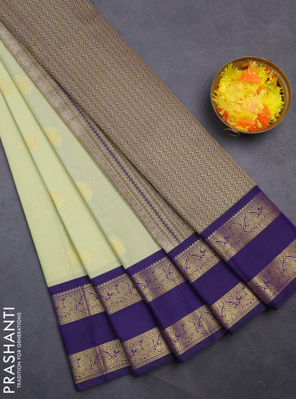 Semi kanchipuram silk saree pista green and blue with allover small zari checks & buttas and rettapet zari woven korvai border