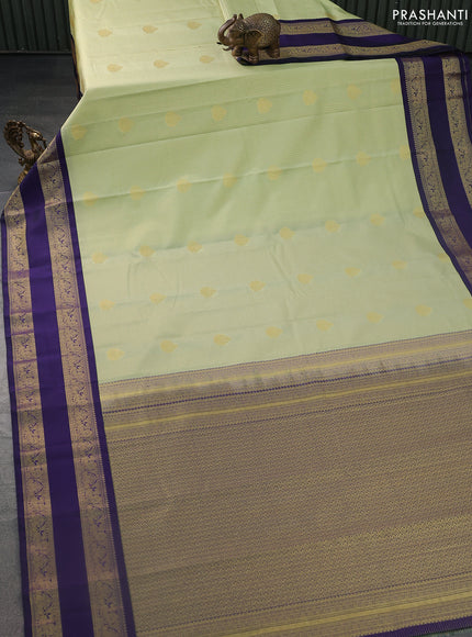 Semi kanchipuram silk saree pista green and blue with allover small zari checks & buttas and rettapet zari woven korvai border
