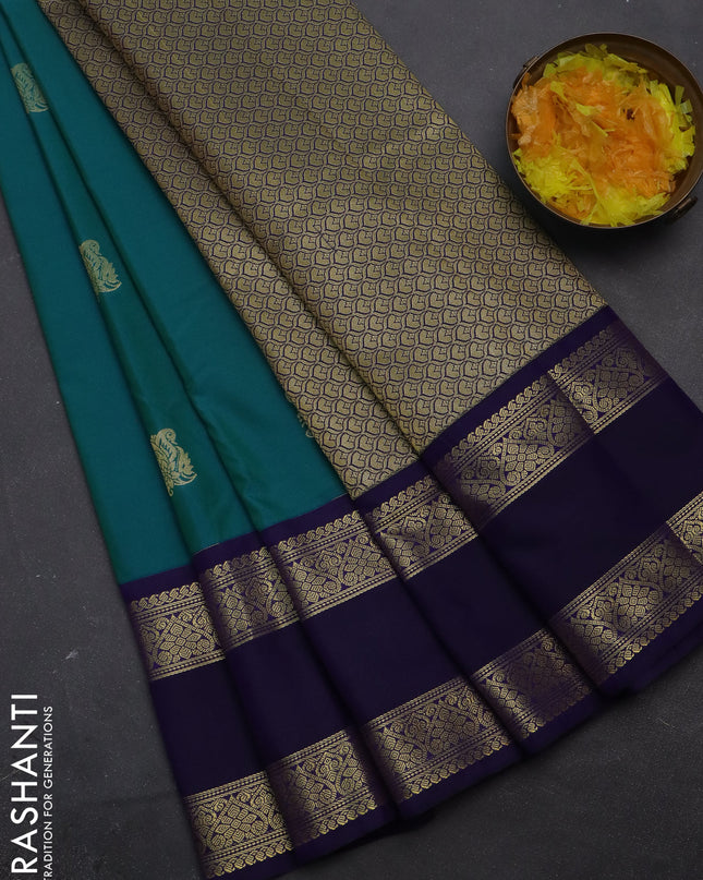 Semi kanchipuram silk saree dual shade of teal blue and navy blue with zari woven buttas and rettapet zari woven korvai border