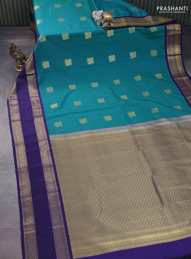 Semi kanchipuram silk saree dual shade of teal blue and navy blue with zari woven buttas and rettapet zari woven korvai border