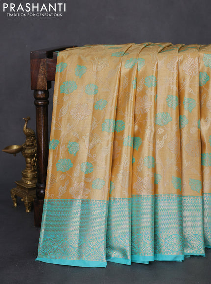 Bangalori tissue silk saree gold and teal blue with zari woven floral design brocade pattern and zari woven border