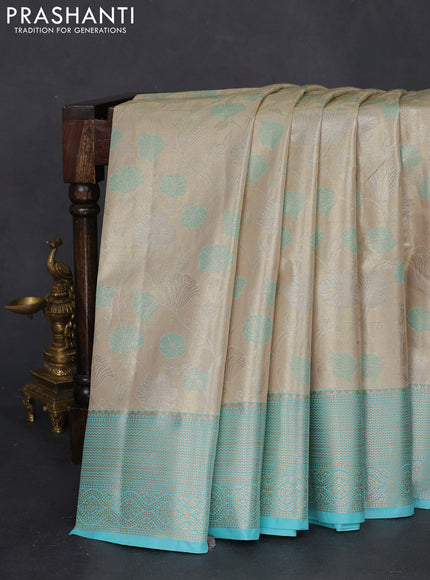 Bangalori tissue silk saree beige and teal blue with zari woven floral design brocade pattern and zari woven border