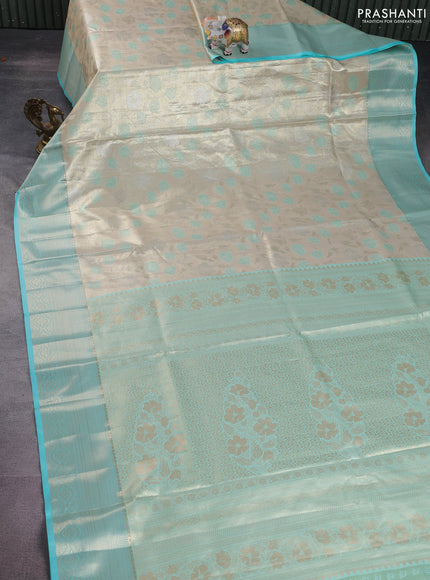 Bangalori tissue silk saree beige and teal blue with zari woven floral design brocade pattern and zari woven border