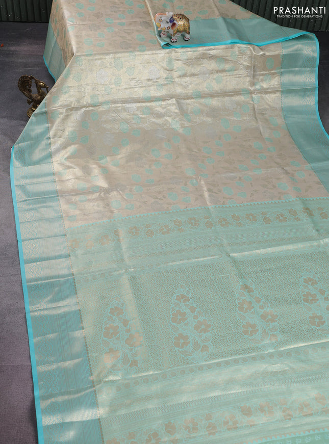 Bangalori tissue silk saree beige and teal blue with zari woven floral design brocade pattern and zari woven border